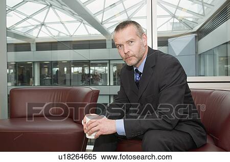 Stock Photography - A seated senior business man. Fotosearch