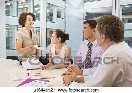 A senior female heads business meeting View Large Photo Image Stock Photo - A senior female heads business meeting. Fotosearch