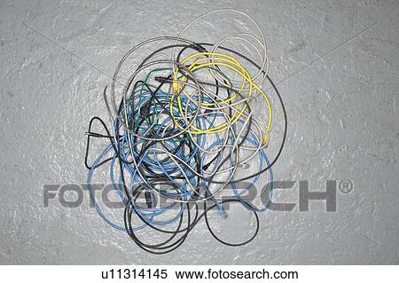 Stock Photography - A tangle of colored wires on the ground. Fotosearch
