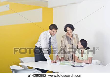 A voyeuristic shot of a meeting View Large Photo Image Stock Image - A voyeuristic shot of a meeting. Fotosearch