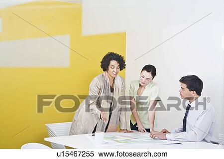 Stock Photography - A voyeuristic shot of a meeting. Fotosearch