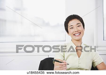A young asian businesswoman View Large Photo Image Stock Photography - A young asian businesswoman. Fotosearch