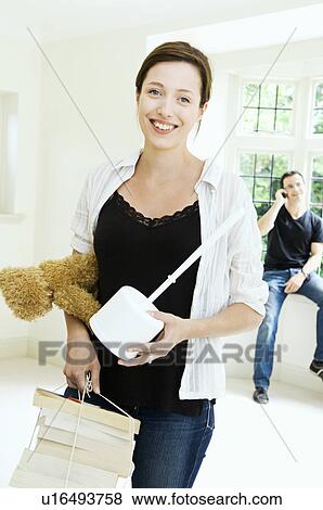 A young couple in a new home View Large Photo Image Stock Photo - A young couple in a new home. Fotosearch