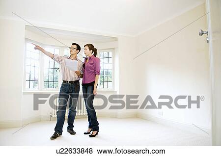 A young couple make house plans View Large Photo Image Stock Photo - A young couple make house plans. Fotosearch
