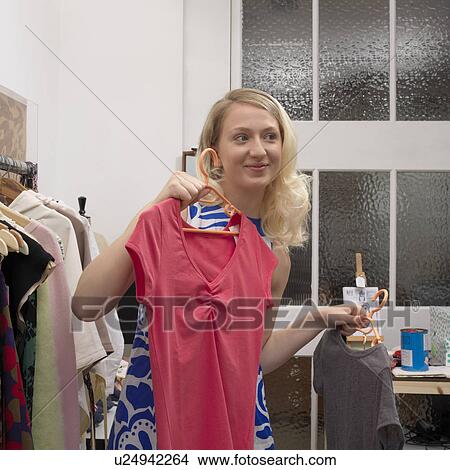 A young woman is shopping View Large Photo Image Picture - A young woman is shopping. Fotosearch