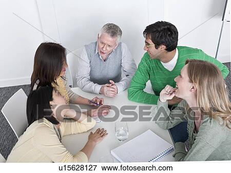 Stock Photo - arm wrestling in group meeting. Fotosearch