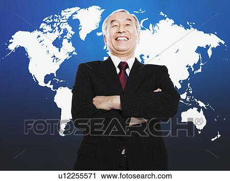 Asian man smiling in front of world map View Large Photo Image Stock Image - Asian man smiling in front of world map. Fotosearch