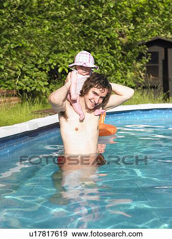 Stock Photo - baby and father in pool. Fotosearch