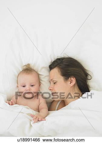 baby and mother in bed View Large Photo Image Stock Photograph - baby and mother in bed. Fotosearch
