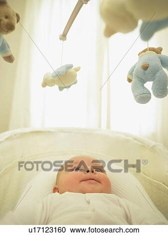 baby looking at mobile View Large Photo Image Stock Image - baby looking at mobile. Fotosearch