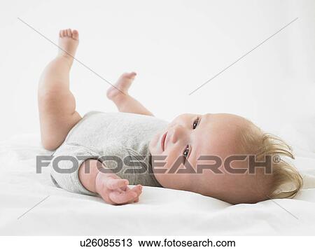 baby on back, smiling View Large Photo Image Stock Image - baby on back, smiling. Fotosearch