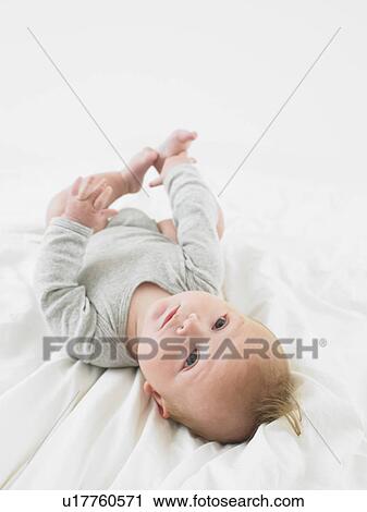 Stock Image - baby on back. Fotosearch