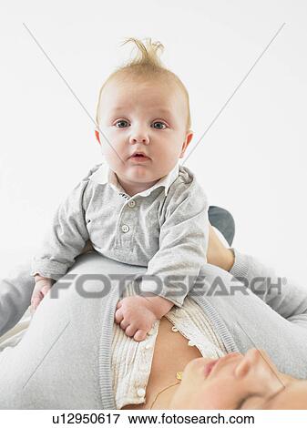 Baby on mother's chest View Large Photo Image Stock Photo - Baby on mother's chest. Fotosearch