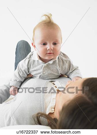 Stock Photo - Baby on mother's chest. Fotosearch