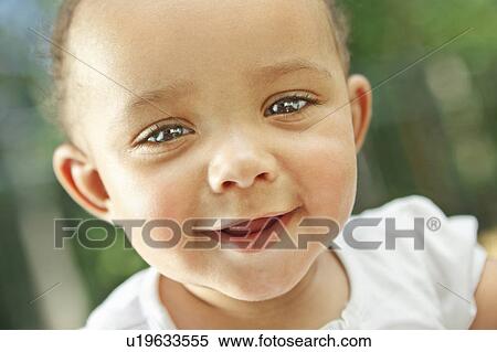 Stock Photography - Baby smiling at camera. Fotosearch