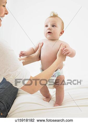 baby standing with help View Large Photo Image Stock Image - baby standing with help. Fotosearch