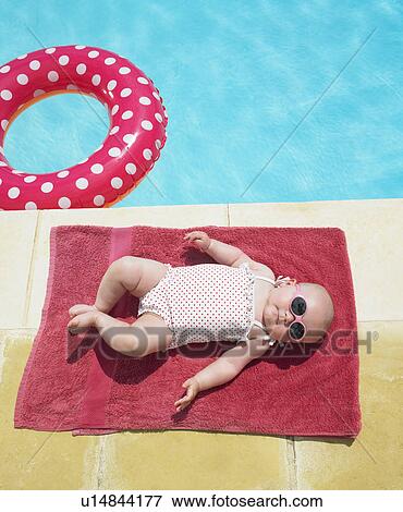 baby sunbathing View Large Photo Image Stock Photo - baby sunbathing. Fotosearch