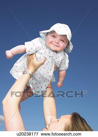 baby up in the air View Large Photo Image Stock Photo - baby up in the air. Fotosearch