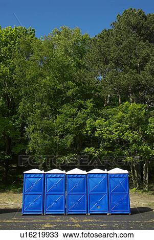 Stock Image - blue portaloos. Fotosearch