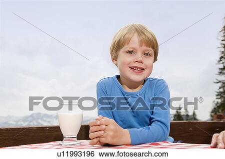 boy drinking milk at mountain hut View Large Photo Image Stock Photograph - boy drinking milk at mountain hut. Fotosearch