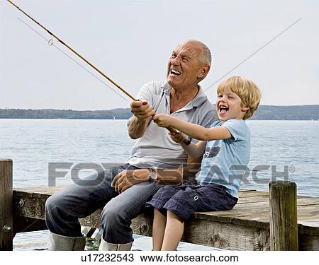 boy fishing with grandfather at lake View Large Photo Image Stock Image - boy fishing with grandfather at lake. Fotosearch