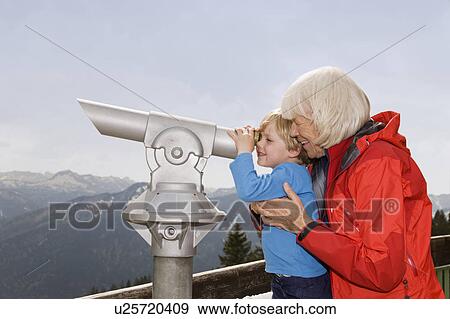 boy, grandma looking through telescope View Large Photo Image Stock Photo - boy, grandma looking through telescope. Fotosearch