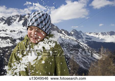 Stock Photograph - Boy hit by snowball.. Fotosearch