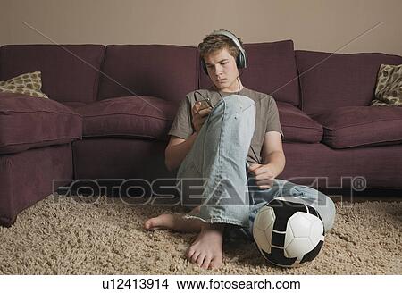 Picture - Boy listening to music. Fotosearch