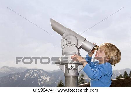 boy looking through telescope View Large Photo Image Stock Image - boy looking through telescope. Fotosearch