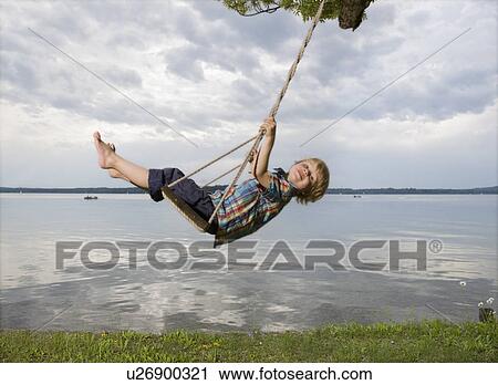 boy on swing View Large Photo Image Stock Image - boy on swing. Fotosearch