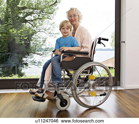 boy sitting on senior woman's lap View Large Photo Image Stock Photograph - boy sitting on senior woman's lap. Fotosearch