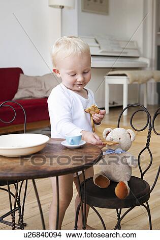 Boy toddler at tea party with his teddy View Large Photo Image Picture - Boy toddler at tea party with his teddy. Fotosearch