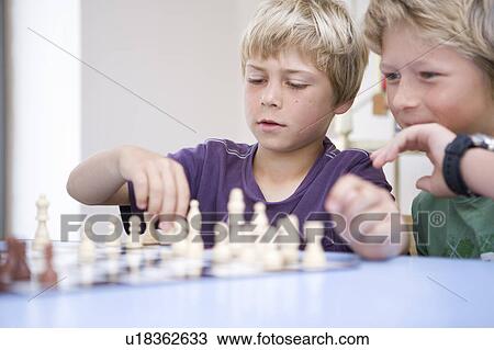 Boys playing chess View Large Photo Image Stock Image - Boys playing chess. Fotosearch
