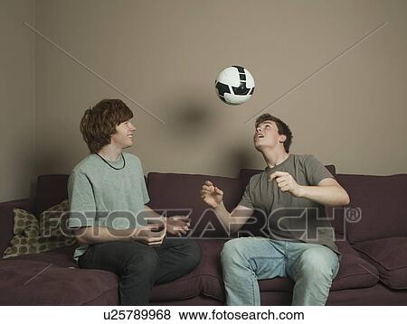 Boys playing football indoors View Large Photo Image Stock Photo - Boys playing football indoors. Fotosearch