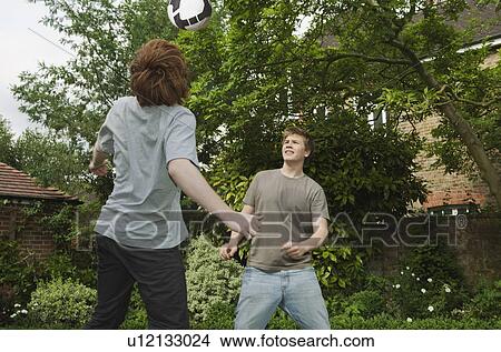Boys playing football View Large Photo Image Picture - Boys playing football. Fotosearch
