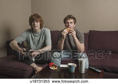 Stock Image - Boys playing video games. Fotosearch