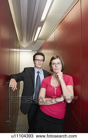 Business couple in a store cupboard View Large Photo Image Stock Image - Business couple in a store cupboard. Fotosearch