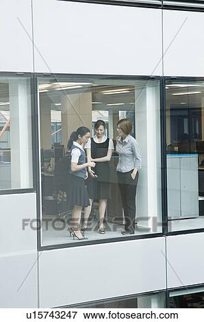 Business females talking View Large Photo Image Stock Photo - Business females talking. Fotosearch