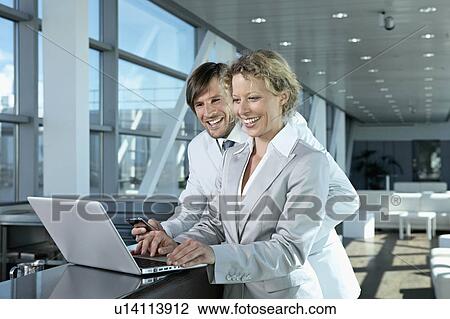 business man and woman with computer View Large Photo Image Stock Image - business man and woman with computer. Fotosearch