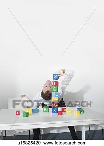 Business man bends over backwards View Large Photo Image Stock Image - Business man bends over backwards. Fotosearch