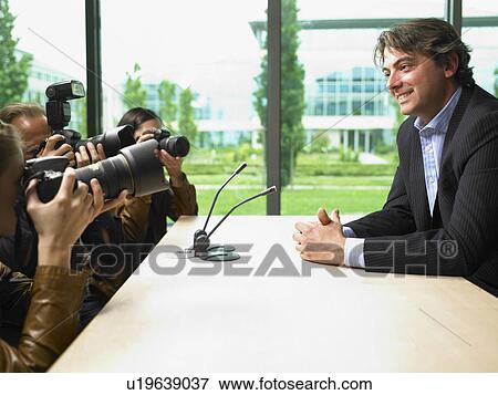Business man giving a conference View Large Photo Image Stock Photo - Business man giving a conference. Fotosearch
