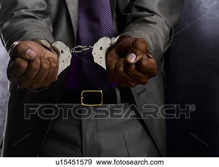 Business man in handcuffs View Large Photo Image Stock Photo - Business man in handcuffs. Fotosearch