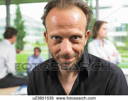 Stock Photography - Business man looking at camera. Fotosearch