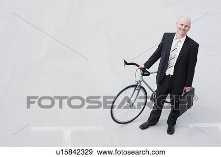 business man with bycicle View Large Photo Image Stock Photo - business man with bycicle. Fotosearch