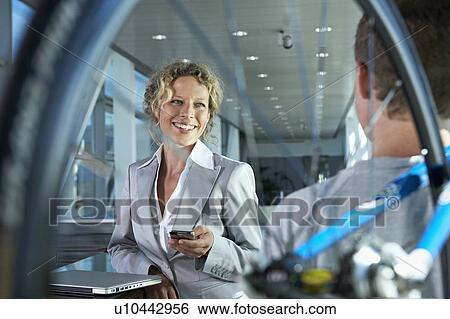 Stock Photograph - business woman communicating. Fotosearch