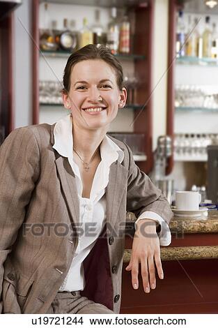 business woman having coffee at bar View Large Photo Image Picture - business woman having coffee at bar. Fotosearch