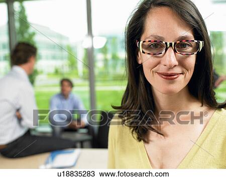 Business woman looking at camera View Large Photo Image Stock Image - Business woman looking at camera. Fotosearch