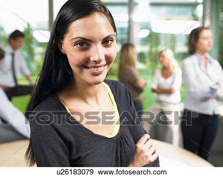 Stock Photo - Business woman looking at camera. Fotosearch
