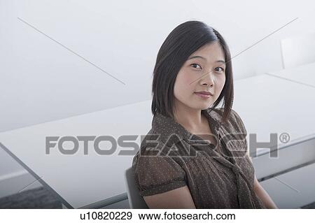business woman sitting in white room View Large Photo Image Stock Photo - business woman sitting in white room. Fotosearch