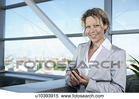 business woman with mobilephone View Large Photo Image Stock Photography - business woman with mobilephone. Fotosearch
